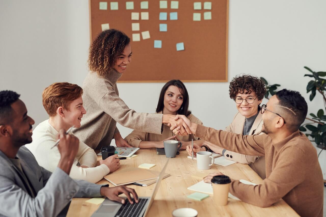 group-of-people-sitting-indoors-3184291 is dataquest worth it? what students say about data science careers section